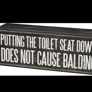 PUTTING THE TOILET SEAT DOWN BALDING BOX SIGN
